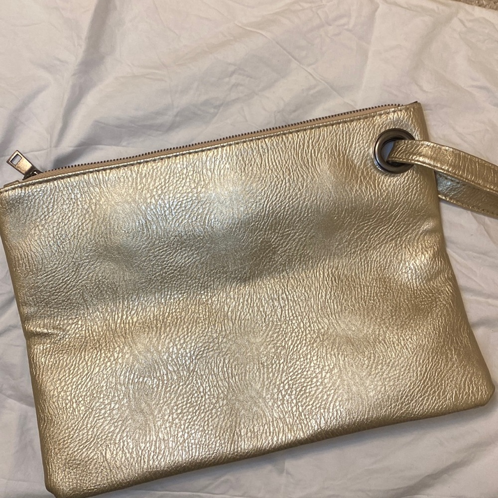 Oversized gold colour wristlet. Perfect for the holiday season. Used once.